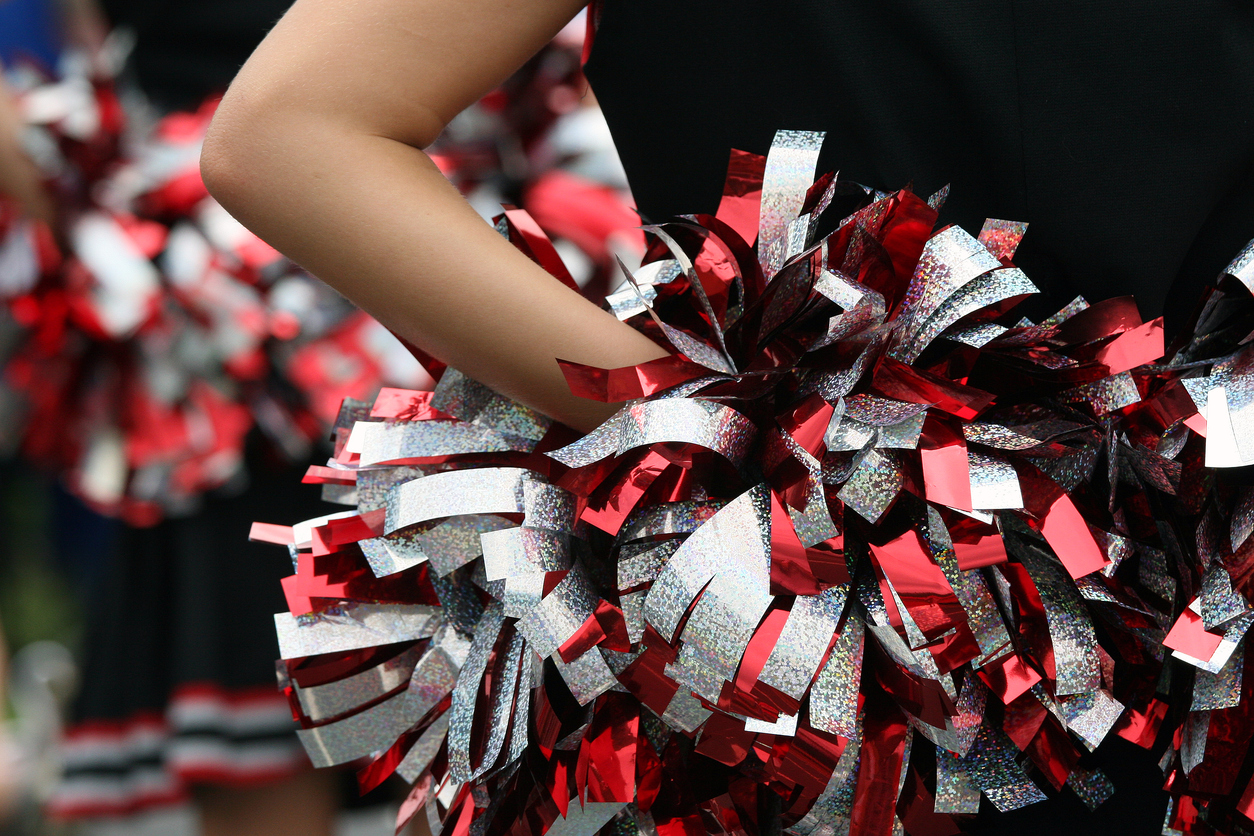 Cheer squad pom-poms mid-routine