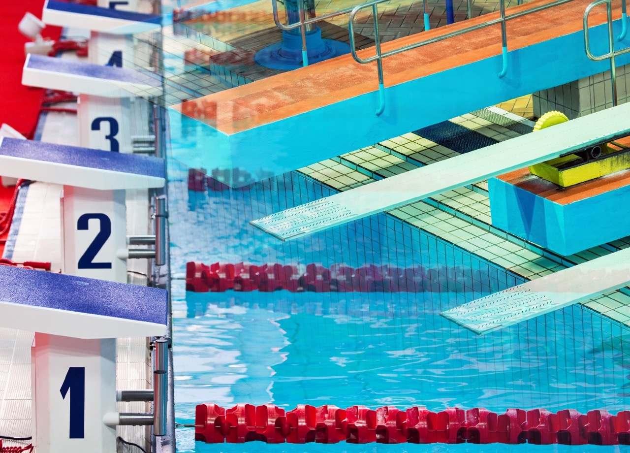 Diving blocks beside an indoor swimming pool